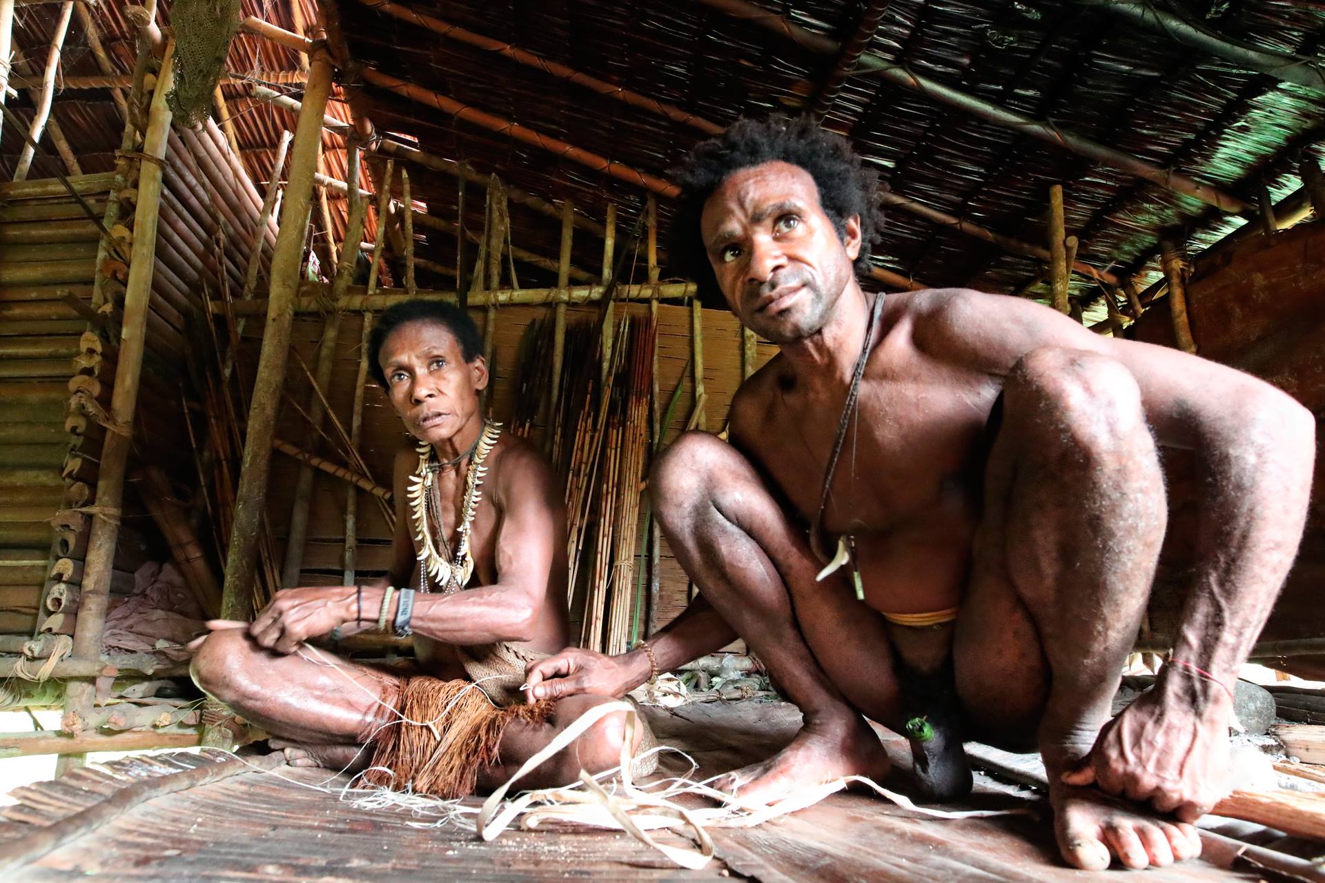 Korowai couple in hut